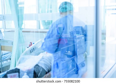 Doctor or nurse during treatment patient cancer in infectious control room.Medical care concept. - Shutterstock ID 755082100