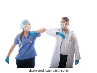 Doctor And Nurse Healthcare Workers Elbow Bump Instead Of Shaking Hands During Icontagious Nfluenza Pandemic Such As SARS Or COVID-19