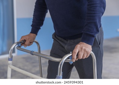 doctor or nurse helping Senior man to walk at nursing home with walker. Doctor or  nurse helping old elderly  man grandfather to walk using walker equipment - Powered by Shutterstock