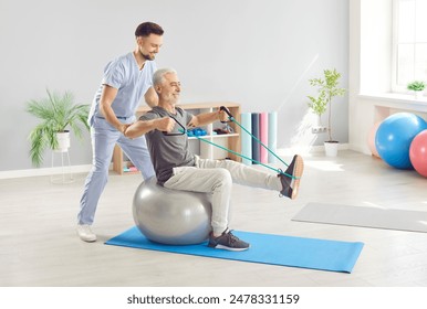 Doctor or nurse involved in the rehabilitation of an elderly patient, conducting physical therapy exercises. Medical professionals in promoting sport and wellness for seniors through exercise. - Powered by Shutterstock