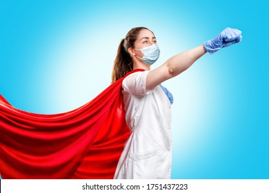 A Doctor Or Nurse In Medical Gloves, A Surgical Mask And A Red Superhero Cape On A Blue Background, Rushes To Help. The Concept Of A Super Hero Power For Clinics And Hospitals. Copy Space