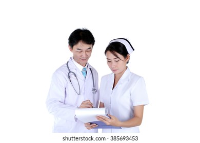 Doctor And Nurse Reviewing Medical Chart, Isolated On White