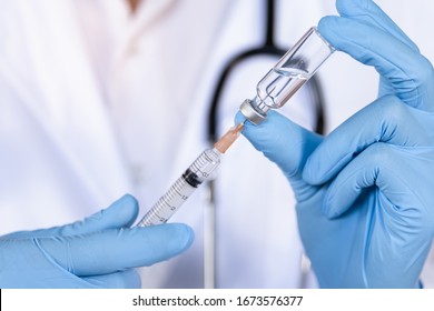 Doctor, Nurse Or Scientist Hand In Blue Nitrile Gloves Holding Flu, Measles, Coronavirus Vaccine Shot For Diseases Outbreak Vaccination, Medicine And Drug Concept