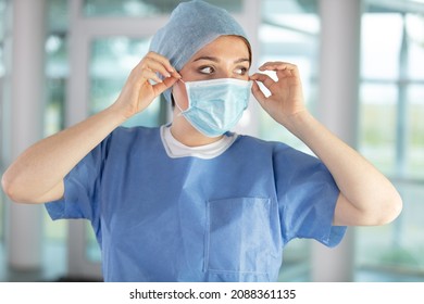 Doctor  Nurse Smiling Behind Surgeon Mask