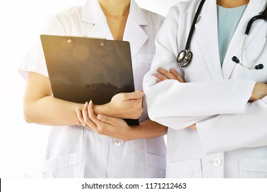 Doctor And Nurse In Uniform, Hospital And Healthcare Staff, Professional Medical Care Provider.