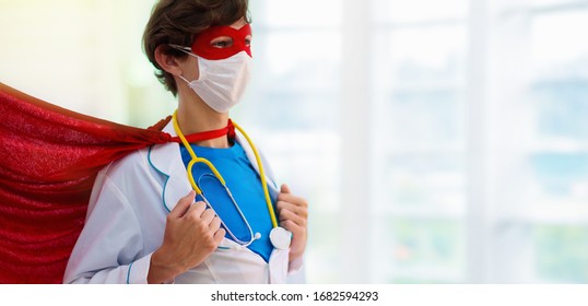 Doctor Or Nurse Wearing Surgical Face Mask In Superhero Cape. Medical Staff During Coronavirus Outbreak. Super Hero Power For Clinic And Hospital Personal.