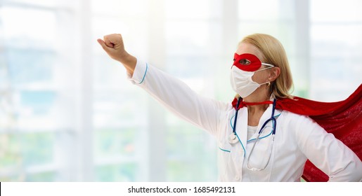 Doctor Or Nurse Wearing Surgical Face Mask In Superhero Cape. Medical Staff During Coronavirus Outbreak. Super Hero Power For Clinic And Hospital Personal.