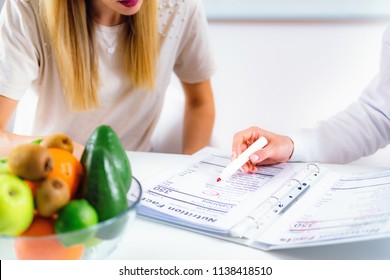 Doctor Nutritionist, Dietician And Female Patient On Consultation In The Office