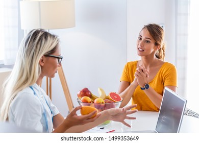 Doctor Nutritionist, Dietician And Female Patient On Consultation In The Office.