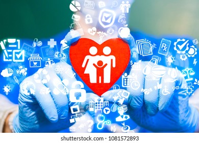 Doctor Offers Red Heart With Family Icon On A Virtual Interface. Family Health. Home Physician.