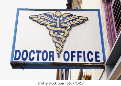 DOCTOR OFFICE Sign And Logo Attached To Building.