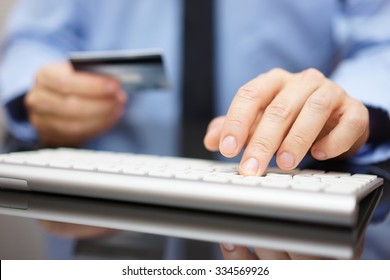 Doctor In Office Working With  Tablet Computer