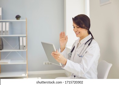 Doctor online. Female doctor using tablet video call speaks with patient by business woman remotely.
