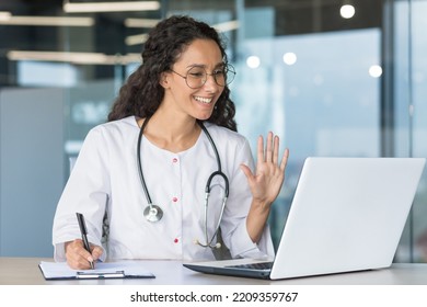 The Doctor Is Online. A Hispanic Female Doctor Participates In An Online Medical Conference, Meeting