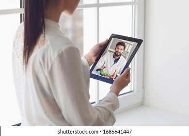 Doctor online. Online medical consultation. Doctor and patient remote consultation on a tablet.