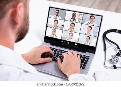 Doctor In Online Medical Video Conference With Diverse Team Of Hospital Workers