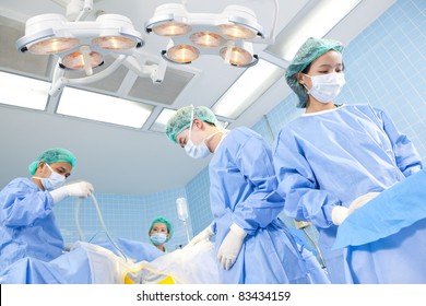 doctor in operation room with his team - Powered by Shutterstock