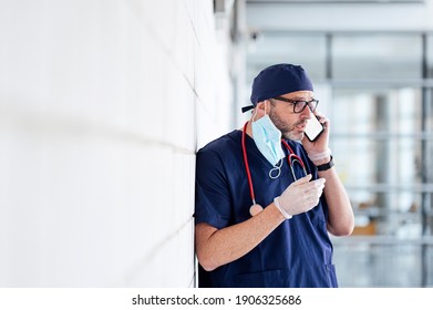 Doctor outside hospital using smart phone