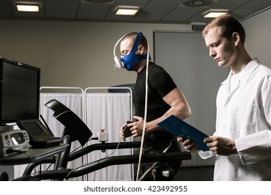 Doctor oversees the endurance test of athlete - Powered by Shutterstock