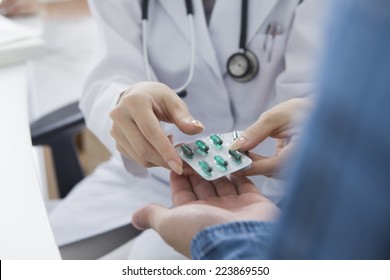Doctor to pass a medicine to a patient