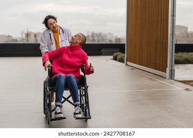 Doctor and patient celebrate their recovery from breast cancer by pushing wheelchairs quickly - Powered by Shutterstock