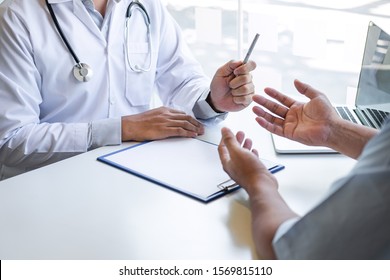 Doctor And Patient Are Discussing Consultation About Symptom Problem Diagnosis Of Disease Talk To The Patient About Medication And Treatment Method.