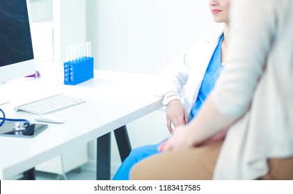 Doctor and patient discussing something while sitting at the table . Medicine and health care concept. Doctor and patient - Shutterstock ID 1183417585