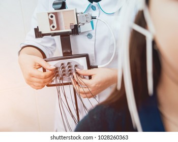 Doctor And Patient With Encephalography Electrode. Electroencephalogram (EEG)