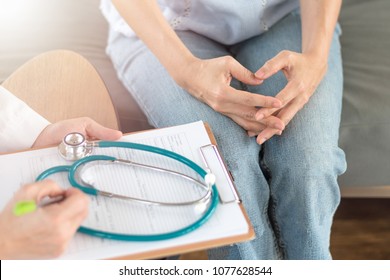 Doctor and patient healthcare concept. Gynecologist physician consulting and examining woman patient health in Obstetrics and Gynecology department in medical hospital health service center.