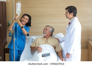 Doctor and patient healthcare concept. doctor and nurse, patient with iv drip in bed in hospital.  - Powered by Shutterstock