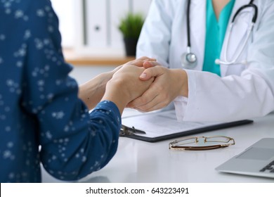 Doctor And Patient Shaking Hands. Partnership, Trust And Medical Ethics Concept