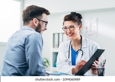 Doctor and patient sitting in doctor's office - Powered by Shutterstock