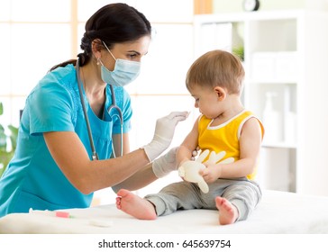 Doctor pediatric holds an injection vaccination the child.