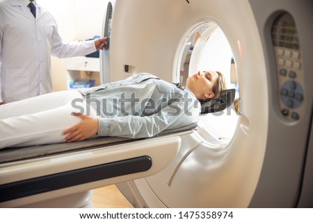 Doctor performing computed tomography test stock photo