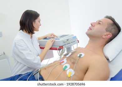 Doctor Is Performing An Electrocardiography