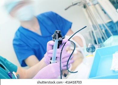 Doctor performs endoscopic procedure in hospital.