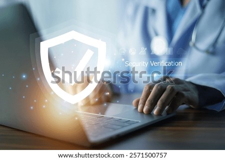 Doctor performs security verification on a laptop, ensuring secure access to sensitive medical data and maintaining patient confidentiality.