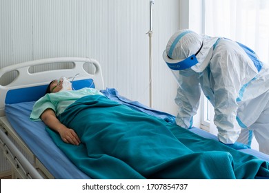 doctor in personal protective equipment or ppe feeling sad and overwhelmed after patient with covid-19 or coronavirus infection has died in the isolation unit during pandemic. medical concept