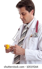 Doctor Or Pharmacist Reading  The Label On A Medicine Bottle