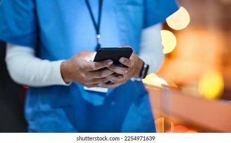 Doctor, phone and healthcare worker hands of a hospital employee at night on social media. Online consulting, mobile communication and wellness consultant woman at a clinic writing a text on web app - Powered by Shutterstock