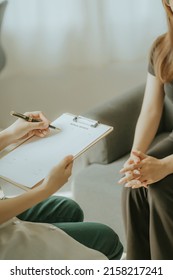 A Doctor Or Physical Therapist Works To Examine The Treatment Of The Injured Arm Of A Male Athlete Patient, Stretching And Exercising, Doing Pain Rehabilitation Therapy In A Clinic.