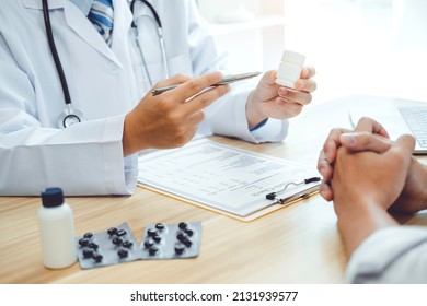 Doctor or physician recommend pills medical prescription to male Patient - Shutterstock ID 2131939577