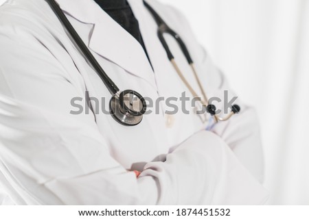 Doctor or physician in white dress uniform and stethoscope at the hospital or clinic Medical Technology, Health and Medical Concept. Physician With Stetoscope In Hospital
