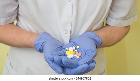 Doctor with pills in hand