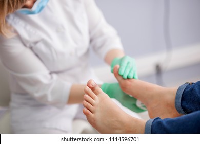 doctor, the podiatrist examines the foot - Shutterstock ID 1114596701