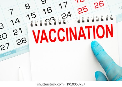 The doctor points to the text VACCINATION. medical concept - Shutterstock ID 1910358757