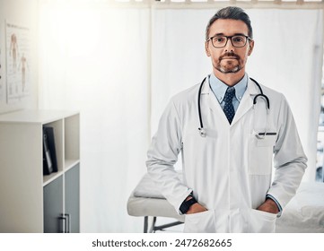 Doctor, portrait and mature man with confidence in hospital for healthcare, consult or expert. Lens flare, urology and physician with stethoscope for medical service, infertility treatment or trust - Powered by Shutterstock