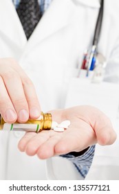 Doctor Pouring Pills On His Palm