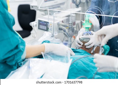 doctor pre oxygenation patient under plastic box