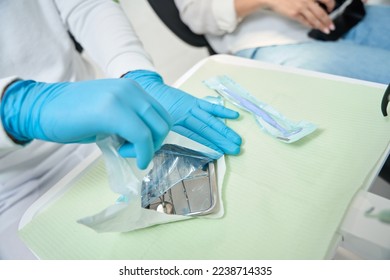 Doctor preparing for conducting examination of patient oral cavity - Shutterstock ID 2238714335